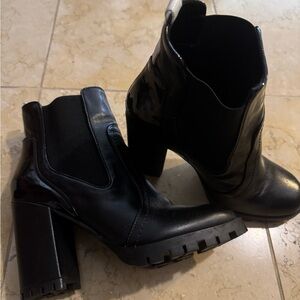 Black lugsole leather booties.